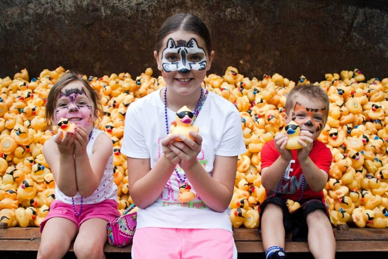 Kids with painted faces enjoying the festival
