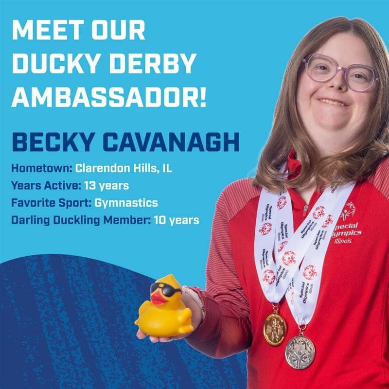 Becky Cavanagh smiling, holding a rubber duck and wearing her Special Olympics medals